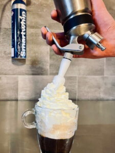 Smartwhip whipped cream on coffee